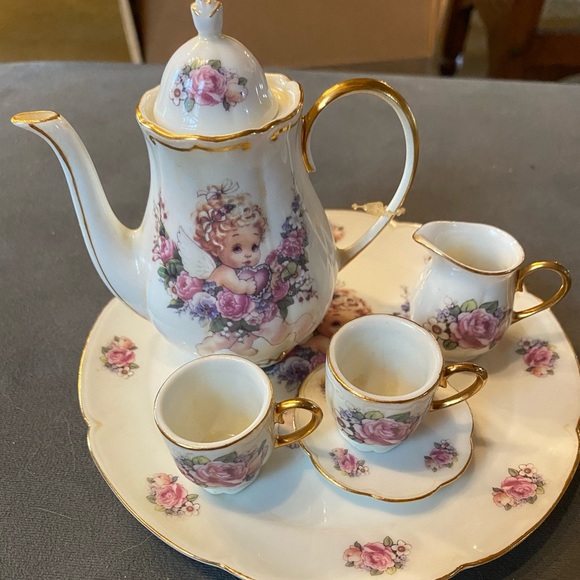 Vintage miniature tea set cherub girl